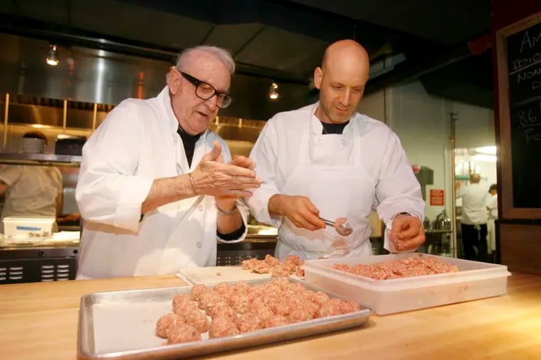 Sal Vetri (left) rolling meatballs with son Marc at Amis restaurant in January 2010.