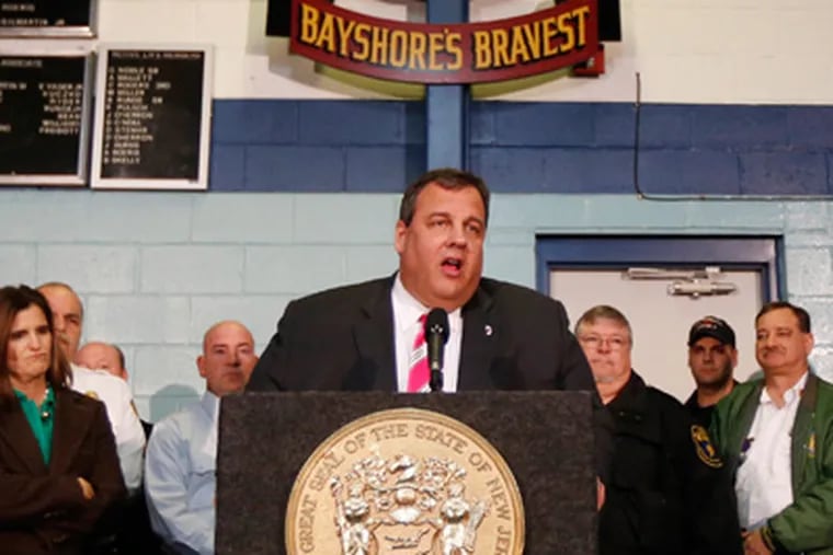 New Jersey Gov. Chris Christie, center, talks during a news conference at at fire house, Monday, Nov. 26, 2012, in Middletown, N.J. Christie announced he will seek re-election to a second term. Christie says he want New Jerseyans to know that he's "in this for the long haul" as he leads the state's recovery from Superstorm Sandy.  (AP Photo/Julio Cortez)