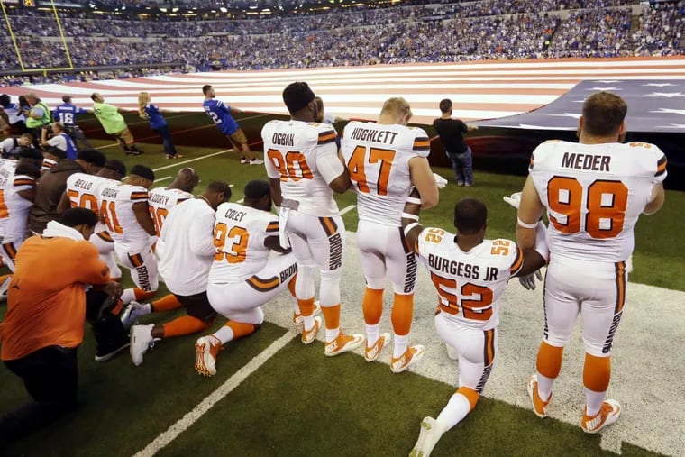 Members of the Cleveland Browns take a knee during the national anthem before an NFL football game against the Indianapolis Colts in Indianapolis, Sunday, Sept. 24, 2017.