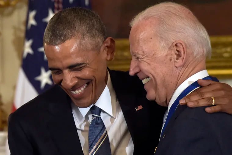 In this Jan. 12, 2017, file photo, then-President Barack Obama laughs with then-Vice President Joe Biden during a ceremony in the State Dining Room of the White House in Washington, at which Obama presented Biden with the Presidential Medal of Freedom.