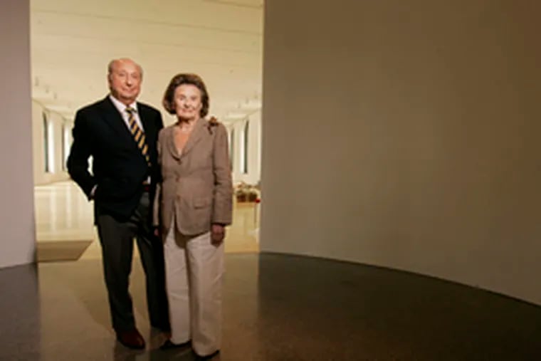 Raymond and Ruth Perelman stand in the entryway to their namesake building&#0039;s Exhibition Gallery. The couple&#0039;s gifts - such as the $15 million they gave the Art Museum in 1999 toward the purchase of the building - are made in both names. Likewise, they bought their myriad pieces of art by mutual consent. &quot;There&#0039;s very little they don&#0039;t agree upon,&quot; their son Ron says.