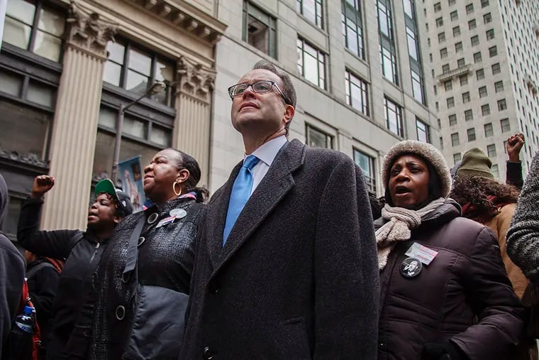Mayoral Candidate Ken Trujillo stands in solidarity with Philadelphia citizens during the MLK Day March Monday, January 19, 2015. (CHRIS FASCENELLI/Staff Photographer)