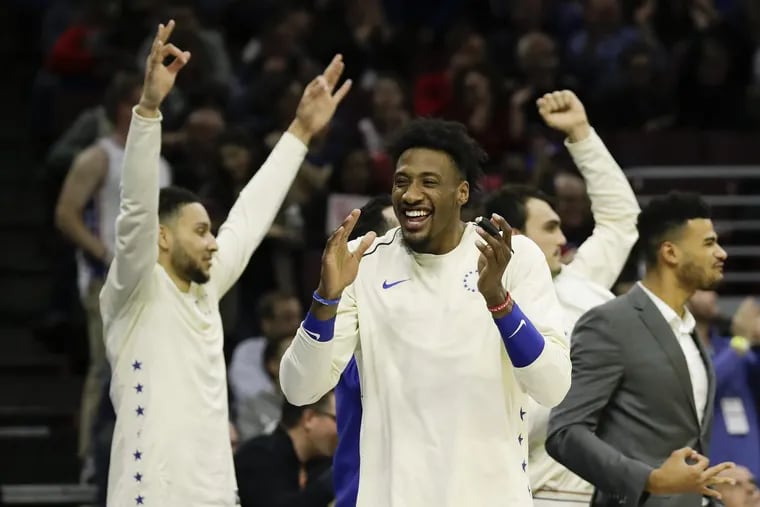 Robert Covington and his teammates celebrate during the Sixers’ 130-95 win over the Milwaukee Bucks in Wednesday’s regular season finale.