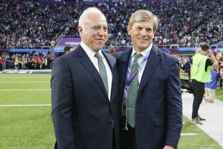 Eagles owner Jeffrey Lurie (left) with Phillies principal owner John Middleton (right) at the Super Bowl last February.