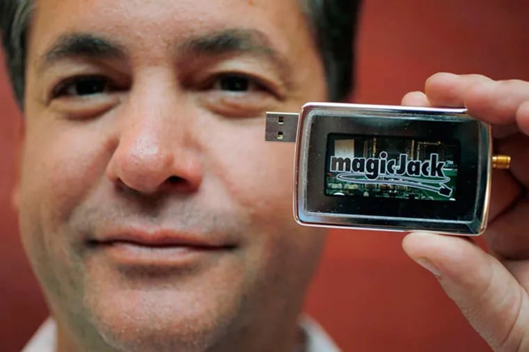 Dan Borislow with a MagicJack, which lets a computer double as a telephone. (AP, File)