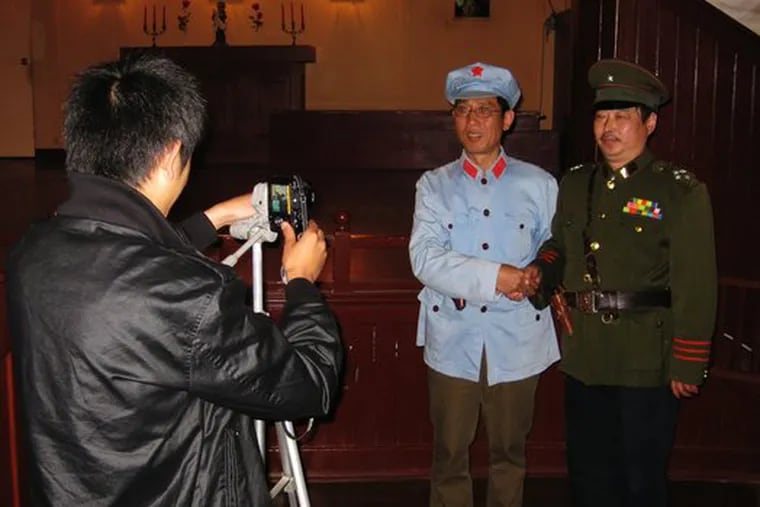 At a restored Christian church in Lushan, people pay to be photographed as generals or revolution-era cadres.