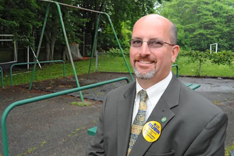 Democratic candidate for Philadelphia City Council's 10th district Bill Rubin at the Baldi Middle School playground, which he says is emblematic of one area where he would focus his efforts - to get playgrounds cleaned up and outfitted so the city's kids have a safe place to play. (Clem Murray / Staff Photographer)