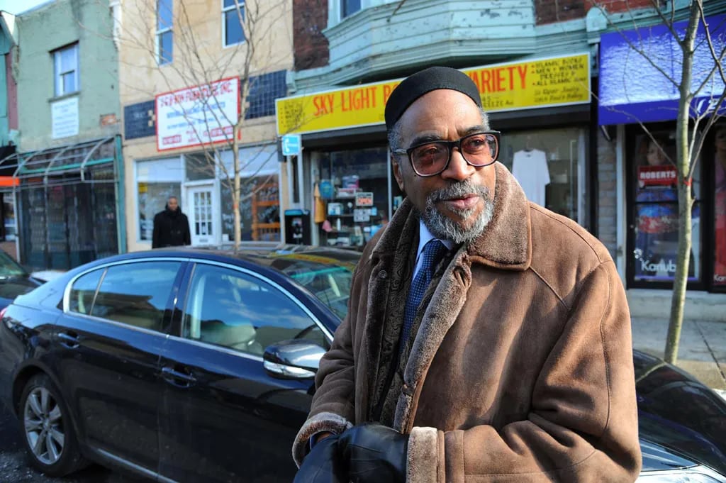 Music mogul and community activist Kenny Gamble walks along Point Breeze Avenue in 2011 between Reed and Dickinson Streets.