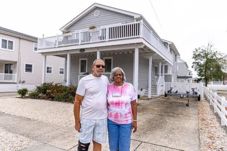 Greg Hudgins, 75, and his wife Rose Hudgins, 76, of Woodbine, N.J., pose for a portrait outside where Rose grew up along  81st Street in Stone Harbor, N.J., on Tuesday, Oct. 12, 2021.