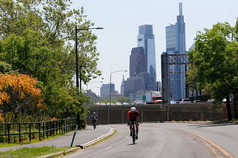 A bicyclists rides on Martin Luther King Drive on Friday, May 21, 2021.