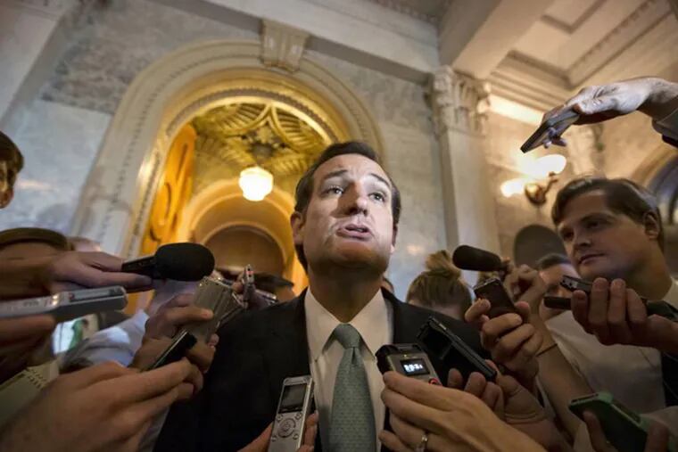 Sen. Ted Cruz, R-Texas talks to reporters as he emerges from the Senate Chamber on Capitol Hill in Washington, Wednesday, Sept 25, 2013, after his overnight crusade railing against the Affordable Care Act, popularly known as "Obamacare."  (AP Photo/J. Scott Applewhite)
