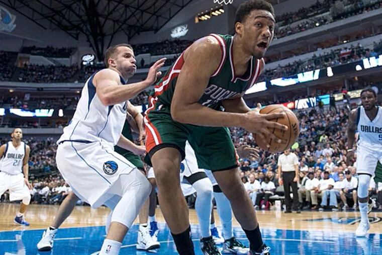 Milwaukee Bucks forward Jabari Parker (12) tries to keep the ball inbounds as Dallas Mavericks guard J.J. Barea (5) defends during the second half at the American Airlines Center. (Jerome Miron/USA TODAY Sports)