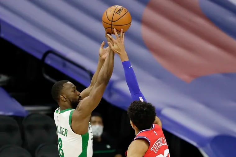 Sixers guard Matisse Thybulle blocks Boston Celtics guard Kemba Walker's third quarter three point attempt on Friday, January 22, 2021 in Philadelphia.