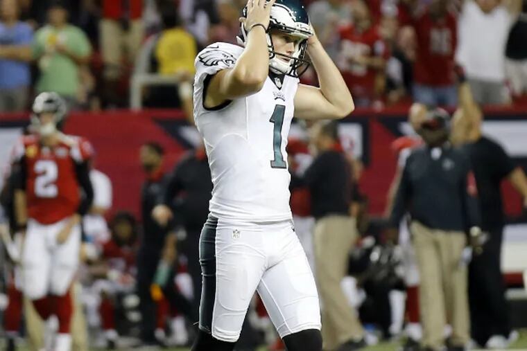 Cody Parkey walks off the field dejectedly after missing a 44-yard field goal against the Falcons.
