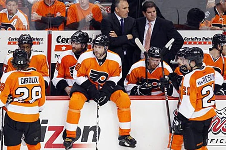 The Flyers trail the Devils two games to one in their second-round playoff series. (Tom Mihalek/AP)