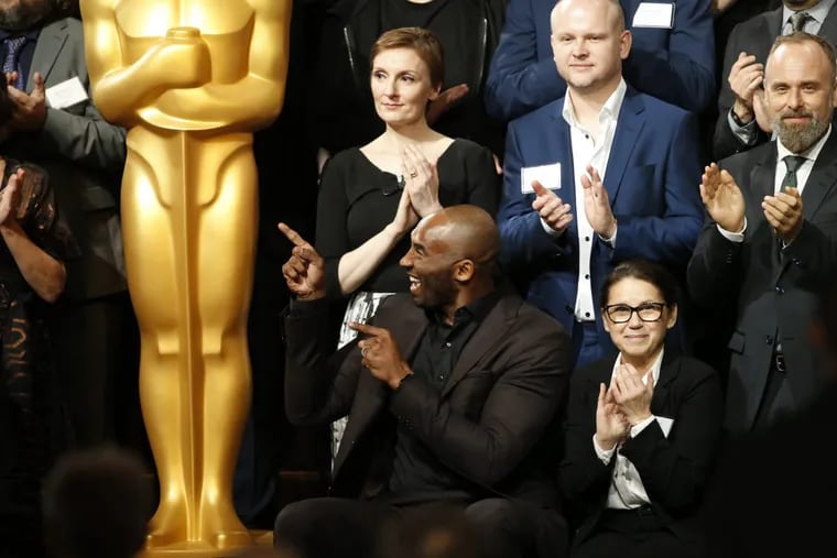 Kobe Bryant, bottom row left, attends the 90th Academy Awards Nominees Luncheon at The Beverly Hilton hotel on Monday, Feb. 5, 2018, in Beverly Hills, Calif.