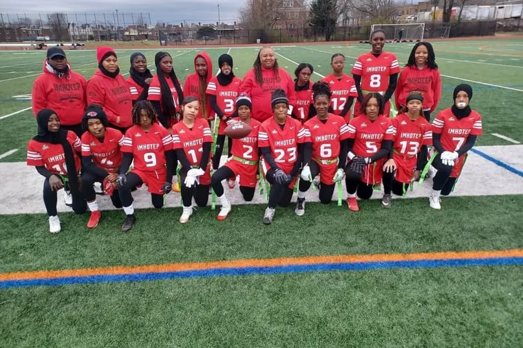 The Imhotep Charter girls' flag football team poses before first game against Kensington High on Friday.