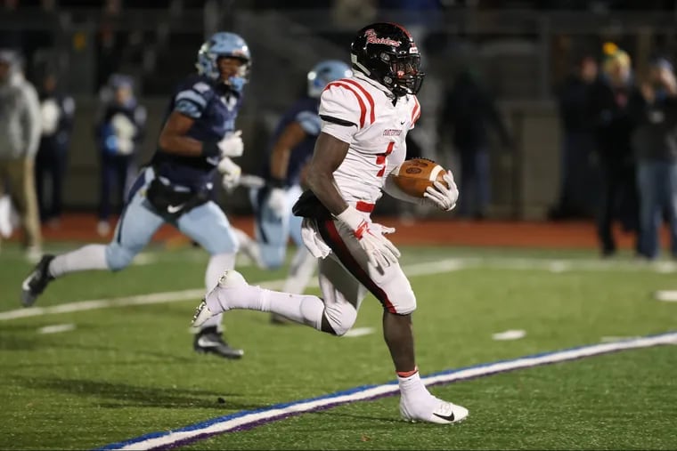 Coatesville senior halfback Aaron Young runs for a 53-yard, third-quarter score in last Friday night's PIAA District 1 Class 6A final against North Penn.