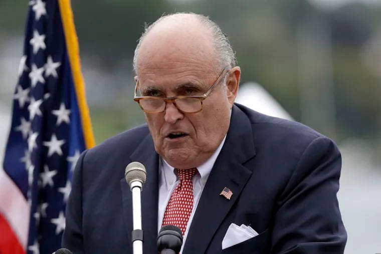 In this Aug. 1, 2018, file photo,Rudy Giuliani, personal attorney for President Donald Trump, speaks in Portsmouth, N.H. Giuliani, says he’s being represented by three lawyers as federal prosecutors in New York look into his business dealings.