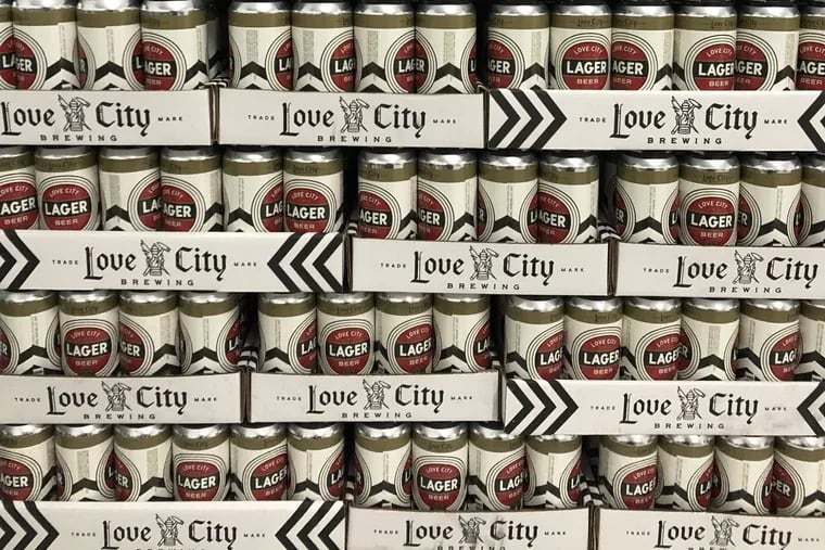 Cans of Love City Lager are stacked and ready drink at Spring Garden's newest brewery.