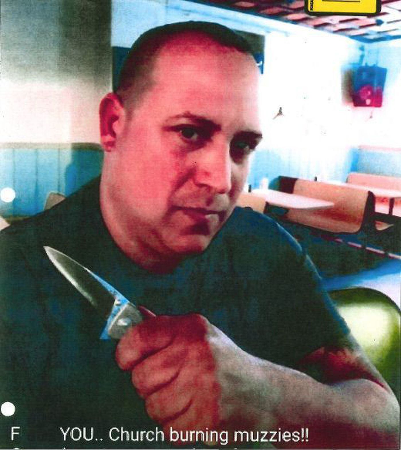 A photo taken from Fred Arena's Facebook page in which he is depicted brandishing a knife and threatening Muslims. Arena, a Navy Yard employee, is charged with lying to federal agents about his ties to white supremacist groups.