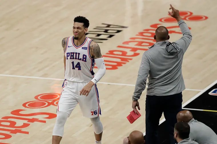 Sixers forward Danny Green grimaces after injuring his calf Friday night against the Atlanta Hawks during the first quarter in Game 3 of the Eastern Conference semifinals.