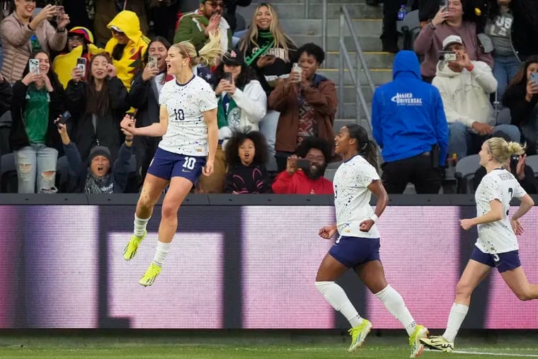 U.S. midfielder and captain Lindsey Horan (left) celebrates after scoring on a penalty kick during the first half.