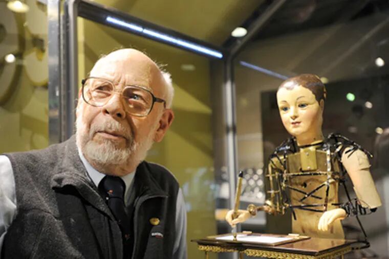 Charles Penniman, a retired Franklin Institute staff educator, with the Maillardet Automaton, which he has long cared for. (Sharon Gekoski-Kimmel / Staff Photographer)