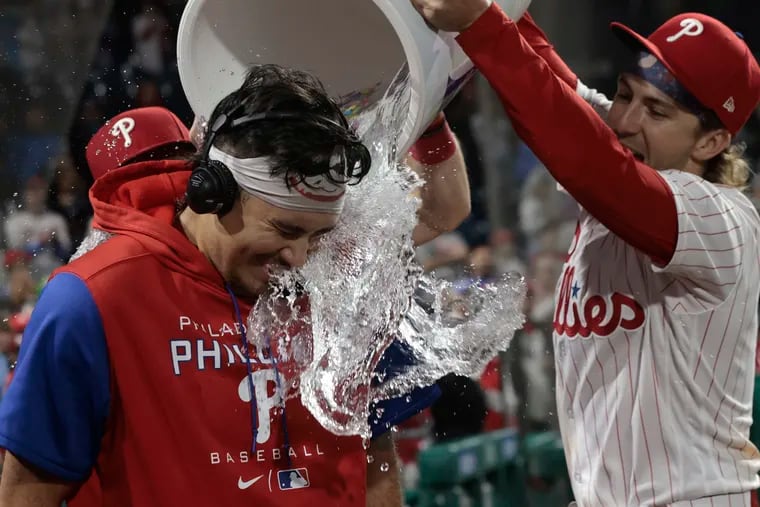 Orion Kerkering gets the Phillies' water bucket treatment after his successful major league debut.