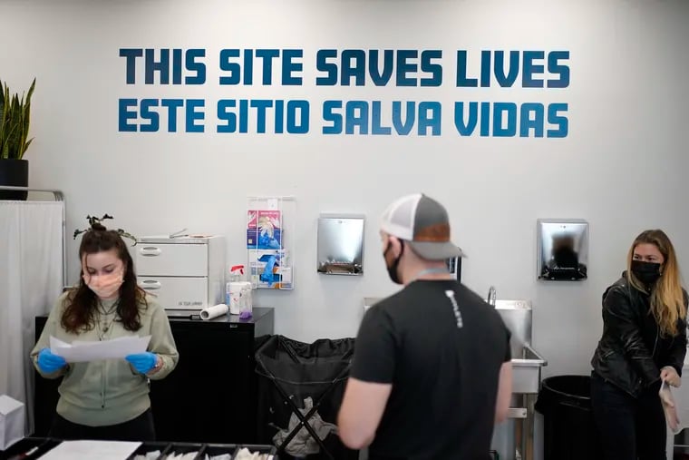 A sign on the wall reads "This site save lives" in Spanish and English at an overdose prevention center at OnPoint NYC in New York City, Friday, Feb. 18, 2022. Equipped and staffed to reverse overdoses, New York City’s new, privately run centers are a bold and contested response to a storm tide of opioid overdose deaths nationwide.