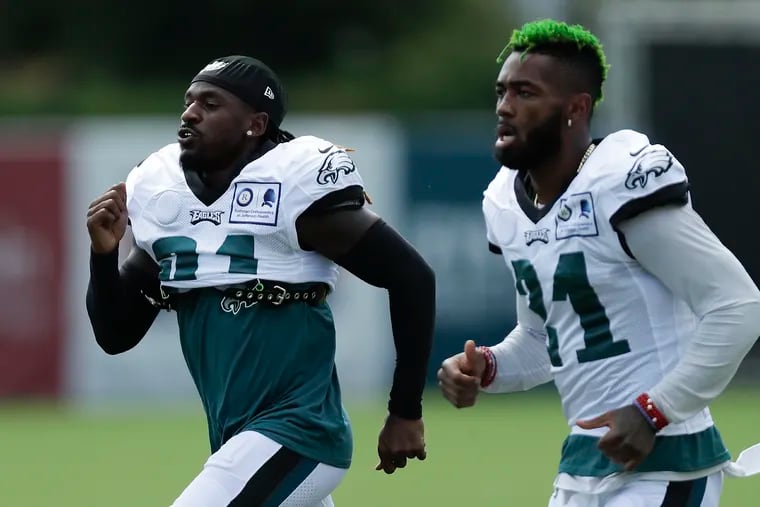 Eagles cornerback Nickell Robey-Coleman (left) has told teammates, including Jalen Mills (right), everything he knows about the Rams offense.