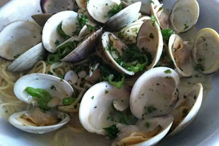 Simple littleneck clams in spicy white sauce at Vincent's Seven/Seven Thirty in Ventnor. (David M Warren / Staff Photographer)