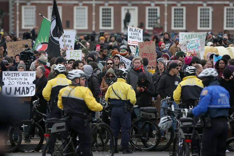 Police hold a line of protestors at bay with their bicycles before the "We the People" rally in support of conservative causes at Independence Mall in Philadelphia on Saturday, Nov. 17, 2018. The rally drew several dozen attendees, while hundreds of protestors showed up.