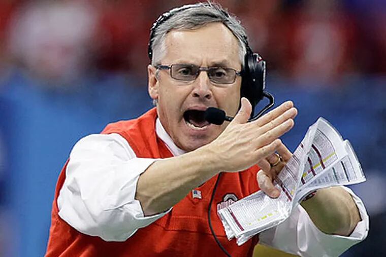 Jim Tressel reportedly made nearly $3.5 million a year as Ohio State's football coach. (Patrick Semansky/AP file photo)