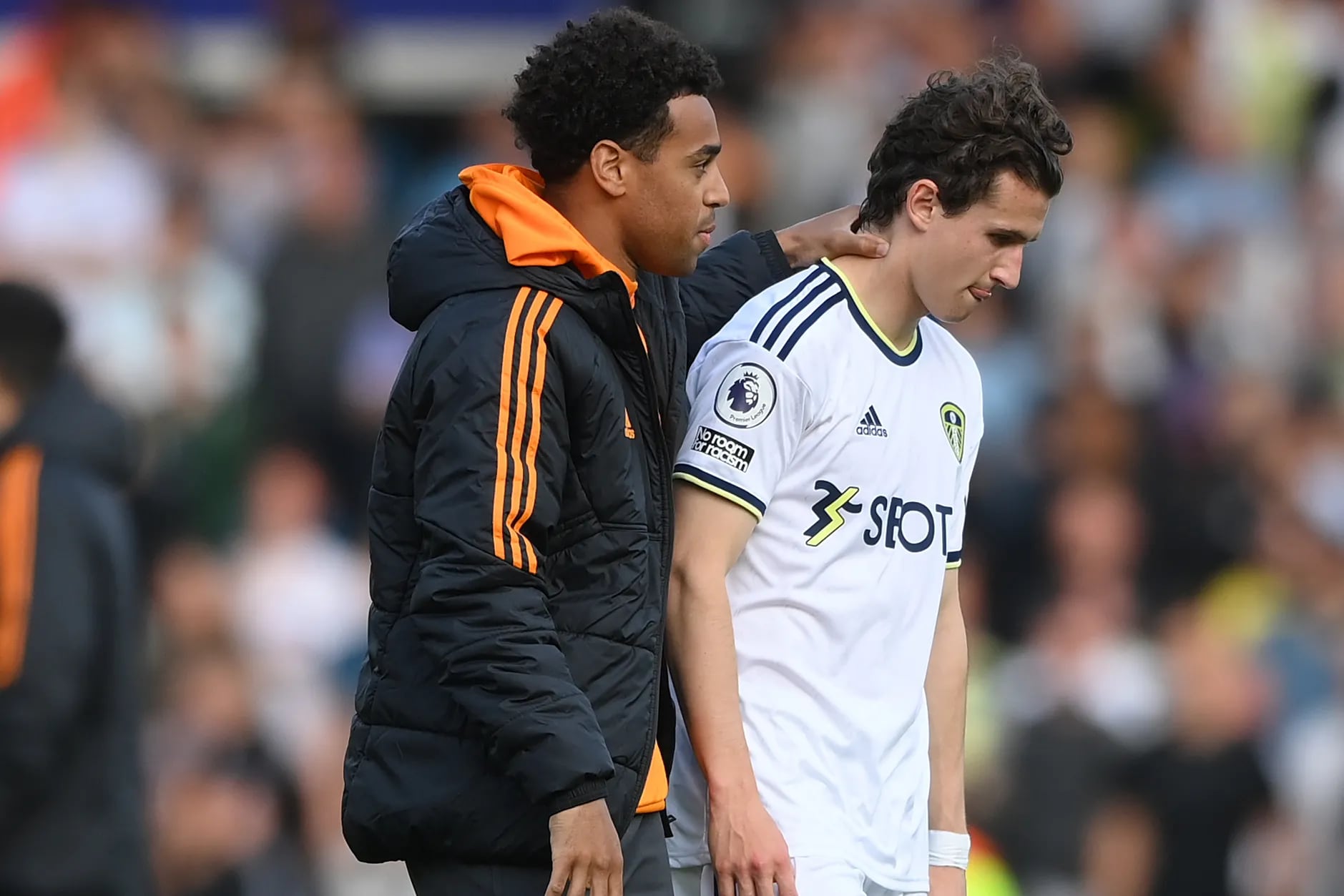 Brenden Aaronson (right) walks off the field with U.S. national team colleague Tyler Adams after their Leeds United squad was relegated from the English Premier League last season.