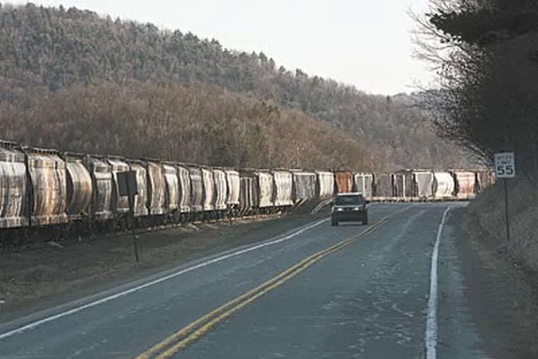 Sand cars on the track along Route 287 will haul sand used to develop gas wells from Corning, N.Y., to Wellsboro, Pa. (Michael S. Wirtz / Staff Photographer)