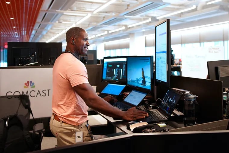A Comcast engineer works at a sit-stand desk, provided by a company found through Comcast’s diverse supplier initiatives, at the new Technology Center.