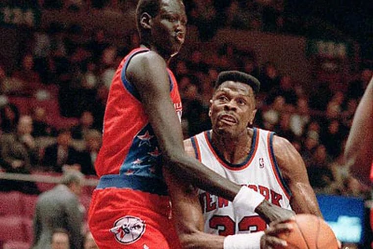 Former 76ers center Manute Bol died Saturday at the age of 47. (Jim Sulley/AP file photo)