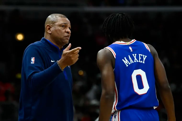 Sixers coach Doc Rivers talks with guard Tyrese Maxey (0) during the first half against the Chicago Bulls.