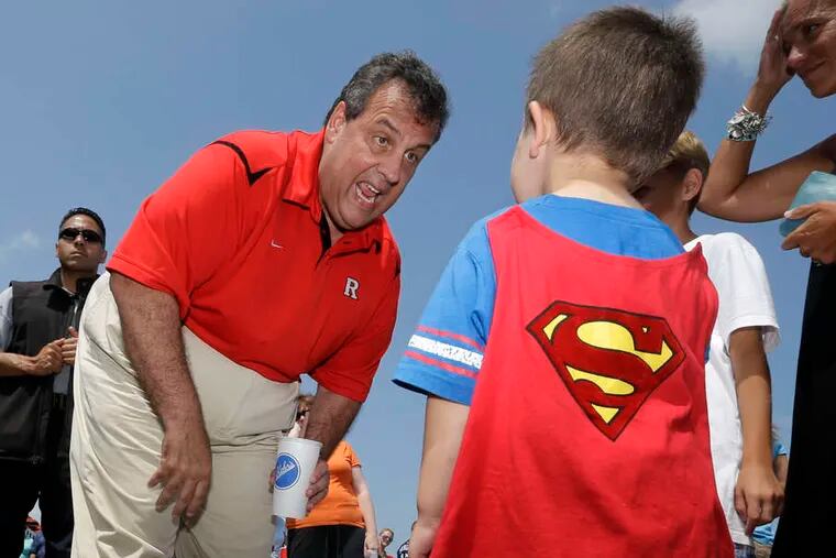 Gov. Christie greets Aidan Walbow, 4, of Fort Lee, who walked the Point Pleasant boardwalk Thursday dressed in his Superman costume.