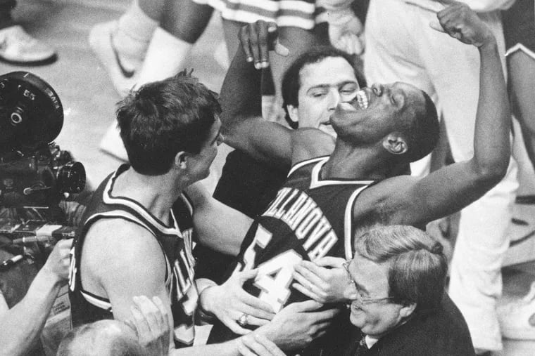 Villanova's Ed Pinckney (54) yells out as he is surrounded by teammates after the Wildcats' famous 66-64 upset of Georgetown in the 1985 NCAA men's basketball championship game.