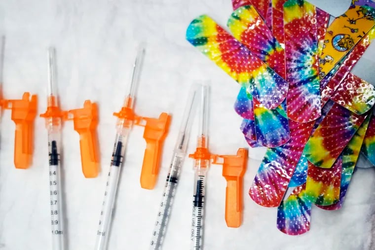 Syringes and colorful bandages are prepared as children over the age of 5 prepare to get COVID-19 vaccines in Pittsfield, Mass., last year.