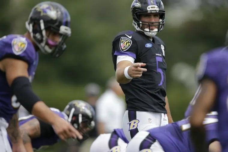 Joe Flacco directs the offense during the Ravens' joint practice with the Eagles.