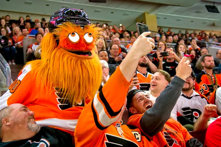 Gritty works the crowd during the Flyers' 8-2 loss.