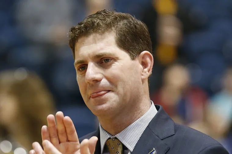 Drexel Head Men's Basketball Coach Zach Spiker claps during senior night festivities before his team played James Madison on Thursday, February 23, 2017 at Drexel. YONG KIM / Staff Photographer