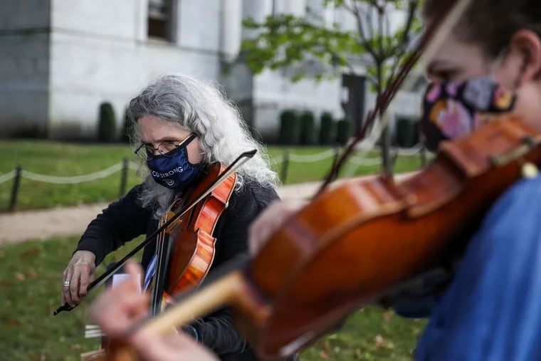 Sarah Adams, a Violist, performs alongside her fellow musician friends and colleagues who drove all the way from New York to perform music as voters walk by at the Delaware County Courthouse and Government Center on Thursday, Oct. 22, 2020.