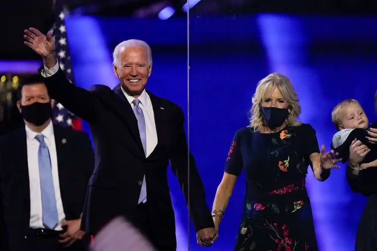 President-elect Joe Biden on stage with his wife Jill on Saturday in Wilmington.