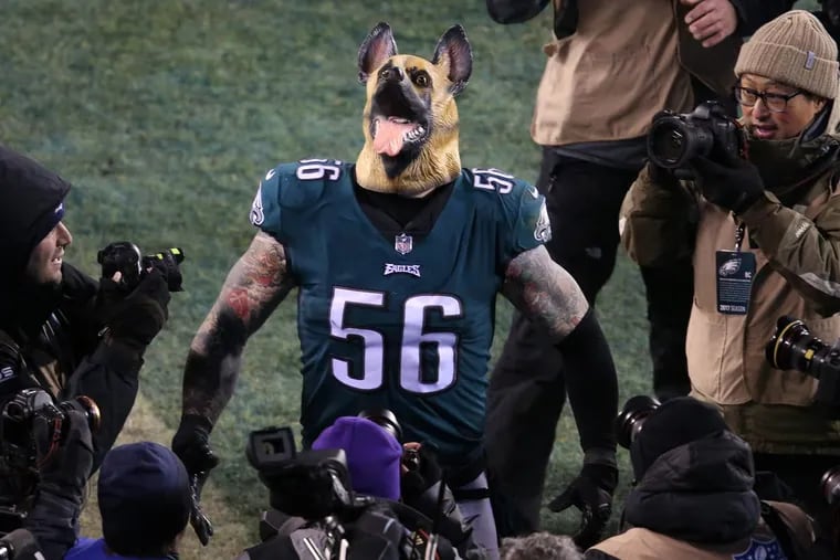 Eagles defensive end Chris Long shows off his underdog mask following the team’s 15-10 win over the Falcons in the NFC Divisional playoff game at Lincoln Financial Field.