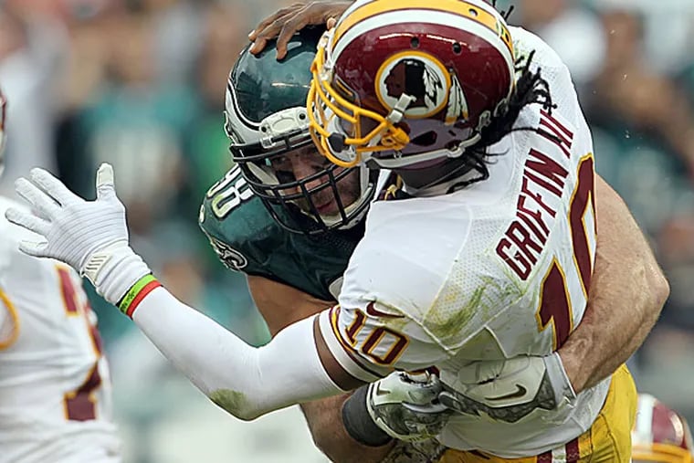 Eagles linebacker Connor Barwin hits Redskins quarterback Robert Griffin III. (Yong Kim/Staff Photographer)