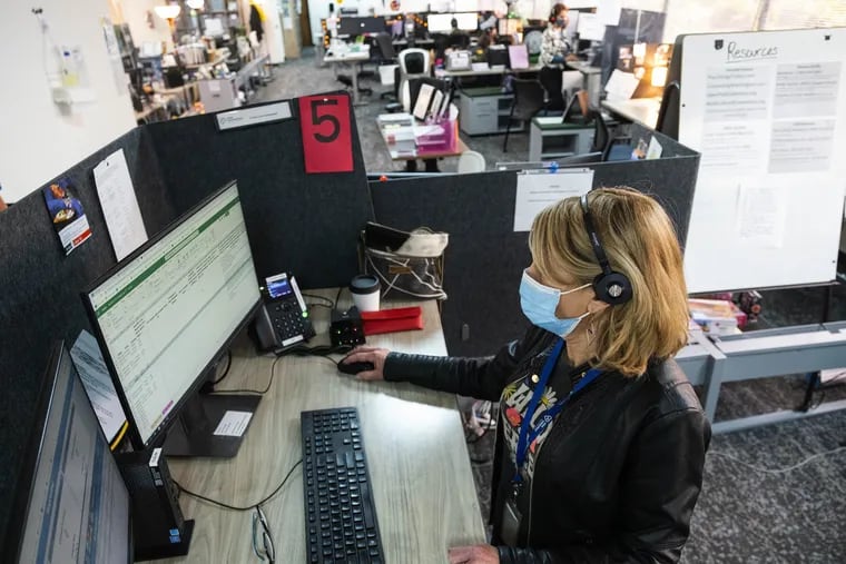 Phone workers take calls at a Seattle crisis line center. Soon they will be taking mental health calls made to the new 988 hotline.